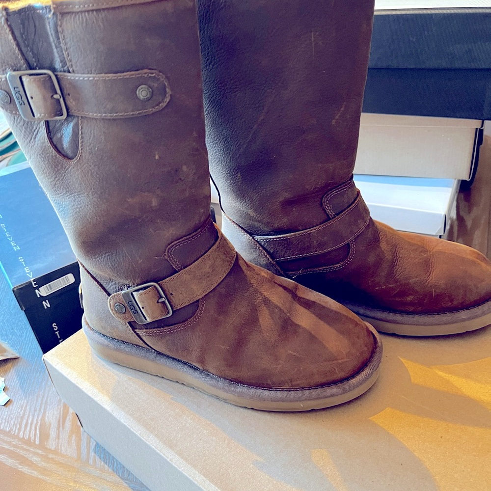 Brown leather Authentic Ugg Boots
w/ Metal Buckling. Worn only twice Size 6.